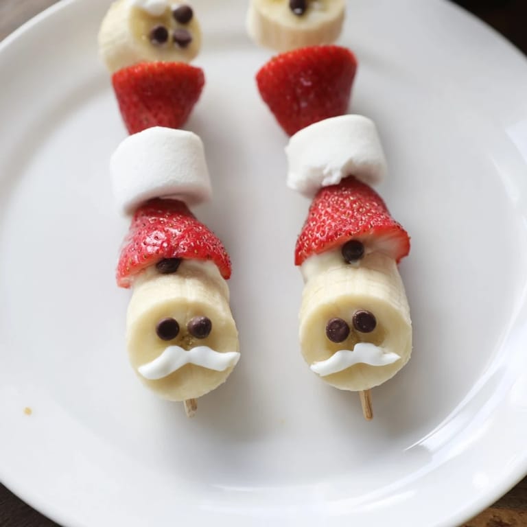 Imagine the charming display of Banana Strawberry Santa Skewers, a delicious and easy holiday treat, perfectly ready to eat.