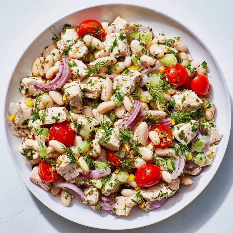 Enjoy a refreshing and flavorful Lemony White Bean Chicken Salad, perfect for a light summer meal.