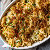 A white bowl filled with a delicious meal.