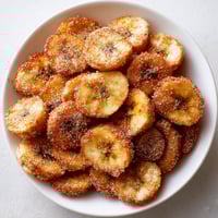 A bowl of cinnamon sugar air fryer banana chips.