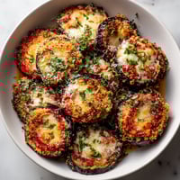 A plate of bouch&eacute;es d'aubergine parmigiana.